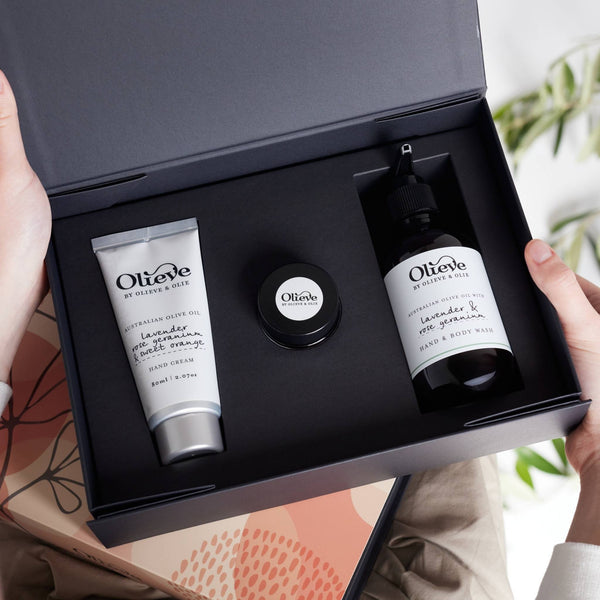 Olieve & Olie Essential Collection Lavender, Rose Geranium & Sweet Orange Gift Set in a beautifully styled lifestyle setting. This handcrafted natural skincare gift box is made with Australian olive oil and thoughtfully presented for gifting